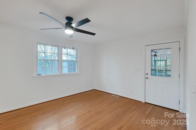 2750 Morgan Rd, Gold Hill, NC 28071 - spare room featuring baseboards, plenty of natural light, wood finished floors, and a ceiling fan