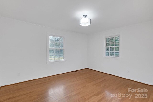2750 Morgan Rd, Gold Hill, NC 28071 - spare room with a wealth of natural light, visible vents, and wood finished floors