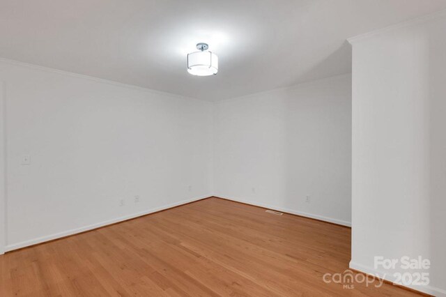 2750 Morgan Rd, Gold Hill, NC 28071 - spare room with crown molding, baseboards, and wood finished floors