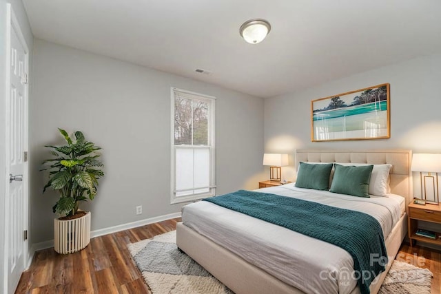 201 Tuckaseege Rd, Mount Holly, NC 28120 - bedroom featuring baseboards, visible vents, and wood finished floors