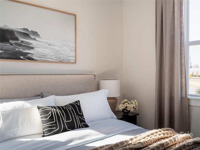 bedroom with multiple windows