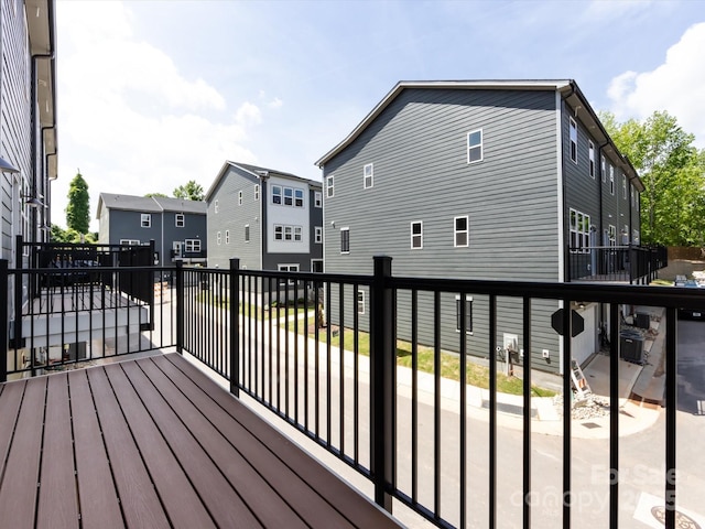 wooden deck with a residential view