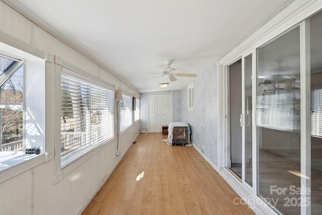 unfurnished sunroom with wood finished floors