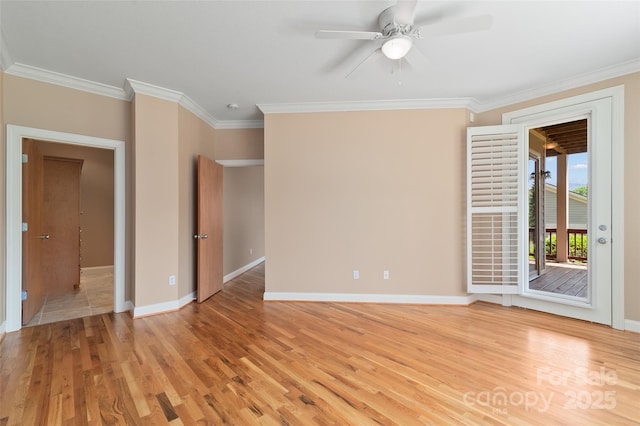 spare room featuring a ceiling fan, baseboards, ornamental molding, and light wood-style floors