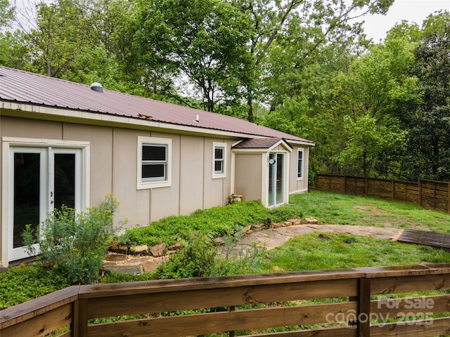 731 Old Fort Rd, Fairview, NC 28730 - rear view of house featuring metal roof, board and batten siding, and french doors