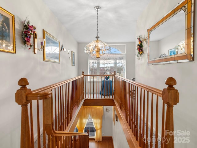 727 Jenkins Valley Rd, Alexander, NC 28701 - stairs with a chandelier and wood finished floors