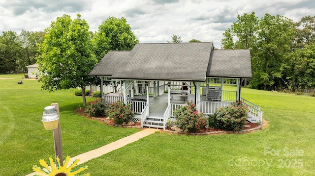 727 Jenkins Valley Rd, Alexander, NC 28701 - view of front of home with a front lawn, a porch, and a shingled roof