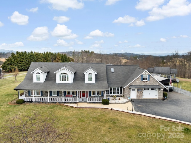 727 Jenkins Valley Rd, Alexander, NC 28701 - view of front of house featuring a porch, a garage, asphalt driveway, and a front lawn