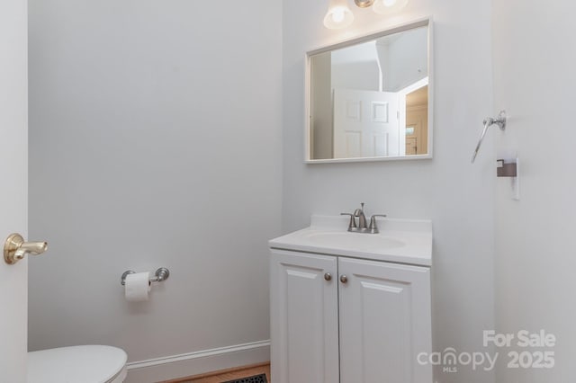 half bath with toilet and vanity