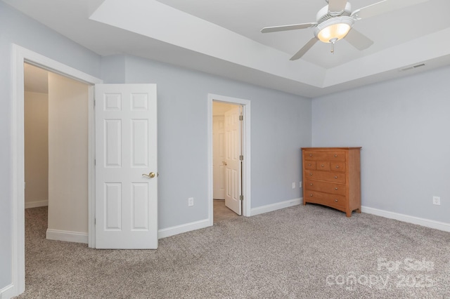 unfurnished bedroom with baseboards, carpet flooring, and visible vents