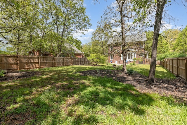 view of yard with a fenced backyard