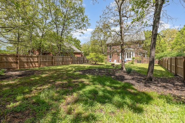 view of yard with a fenced backyard