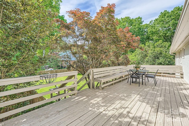 deck featuring outdoor dining area