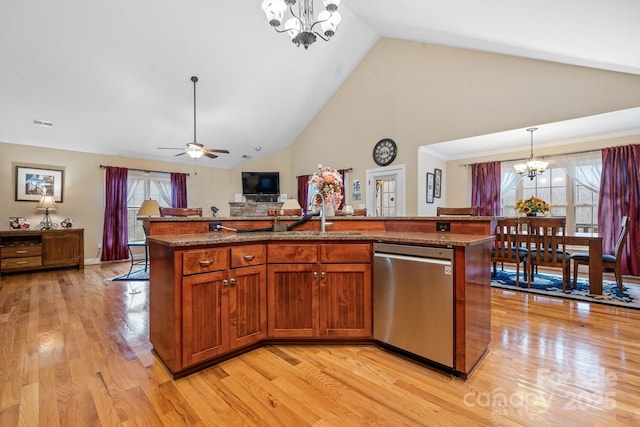 1263 Waterford Dr, Hickory, NC 28602 - kitchen with stainless steel dishwasher, a chandelier, a sink, plenty of natural light, and high vaulted ceiling