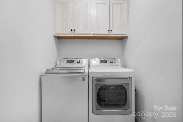 1263 Waterford Dr, Hickory, NC 28602 - laundry room featuring cabinet space and washing machine and clothes dryer