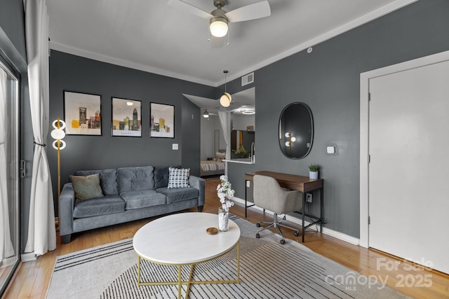 715 N Church St Unit 503, Charlotte, NC 28202 - living area featuring visible vents, baseboards, wood finished floors, and a ceiling fan