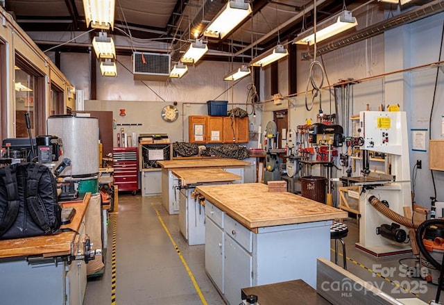 kitchen with finished concrete flooring and butcher block counters