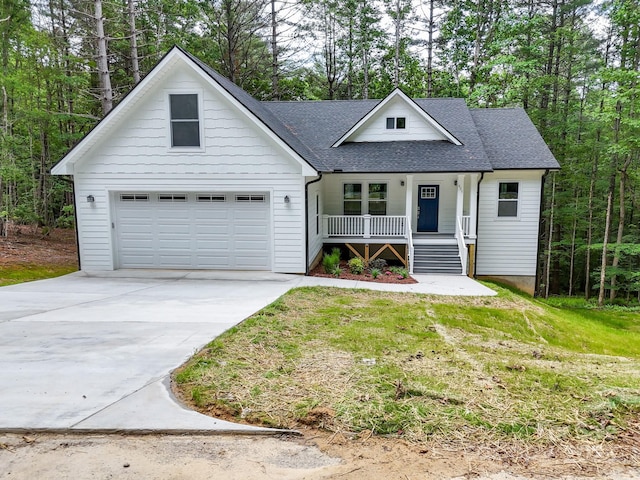 605 Knob Rd, Pisgah Forest, NC 28768 - view of front of house with a porch, driveway, and roof with shingles