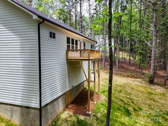 605 Knob Rd, Pisgah Forest, NC 28768 - view of home's exterior featuring crawl space, a deck, and a lawn