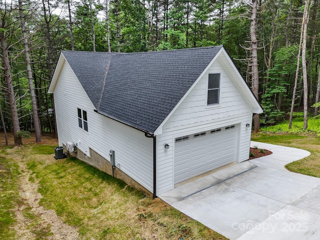 605 Knob Rd, Pisgah Forest, NC 28768 - garage with concrete driveway and cooling unit