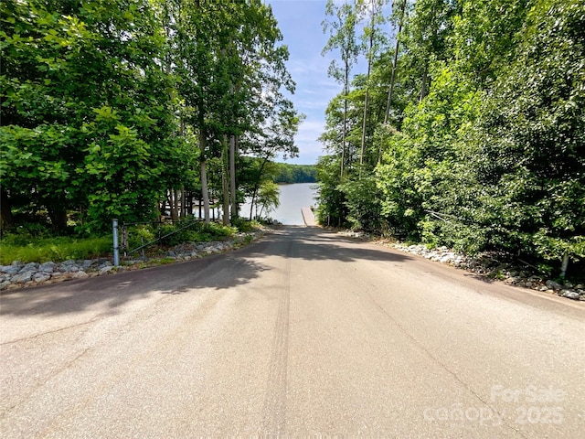8212 Merryvale Ln, Charlotte, NC 28214 - view of asphalt road featuring a water view