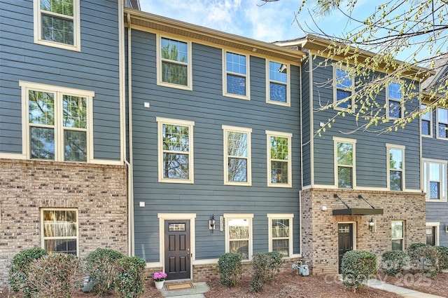 view of property with brick siding