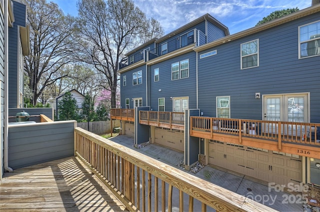 wooden deck featuring a garage