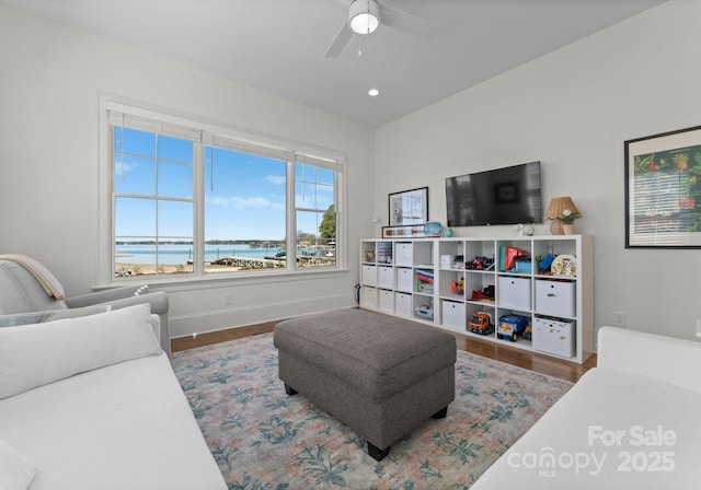 living room featuring baseboards, a ceiling fan, wood finished floors, and recessed lighting