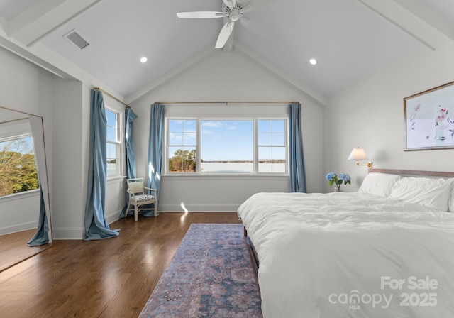 bedroom featuring wood finished floors, visible vents, ceiling fan, and multiple windows