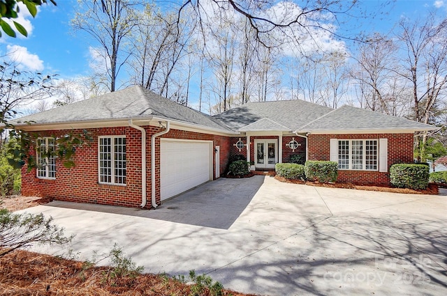 4633 River Bluff Ct, Charlotte, NC 28214 - single story home featuring driveway, french doors, a shingled roof, a garage, and brick siding