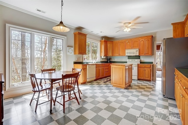 4633 River Bluff Ct, Charlotte, NC 28214 - kitchen with visible vents, ornamental molding, a sink, white appliances, and ceiling fan