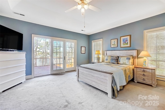 4633 River Bluff Ct, Charlotte, NC 28214 - carpeted bedroom featuring access to exterior, multiple windows, visible vents, and ceiling fan