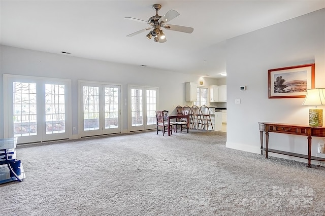 4633 River Bluff Ct, Charlotte, NC 28214 - carpeted living area with baseboards, visible vents, and ceiling fan