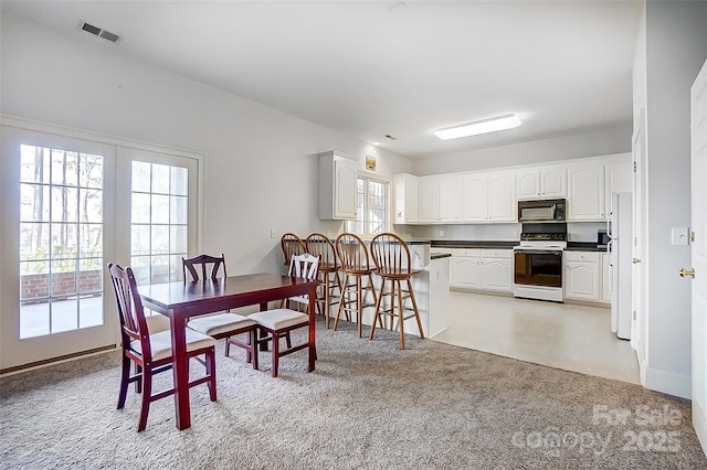 4633 River Bluff Ct, Charlotte, NC 28214 - dining space featuring visible vents and light colored carpet