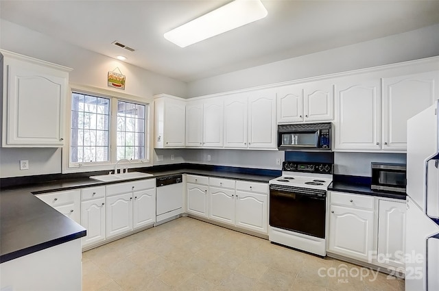 4633 River Bluff Ct, Charlotte, NC 28214 - kitchen featuring dark countertops, visible vents, white appliances, white cabinetry, and a sink