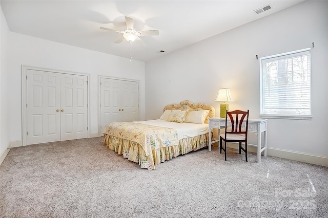4633 River Bluff Ct, Charlotte, NC 28214 - bedroom featuring visible vents, multiple closets, a ceiling fan, carpet flooring, and baseboards