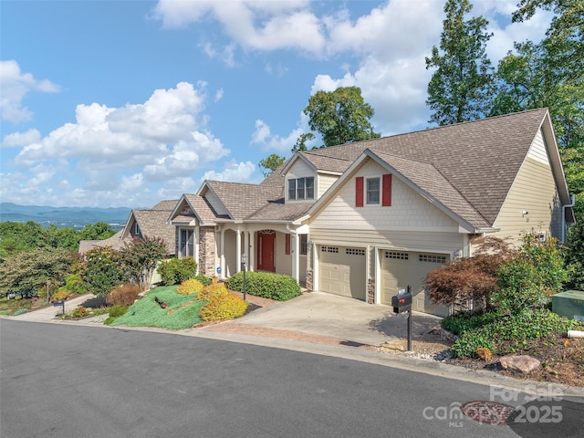 54 Deep Valley Ln, Hendersonville, NC 28791 - craftsman-style home with stone siding, roof with shingles, and driveway