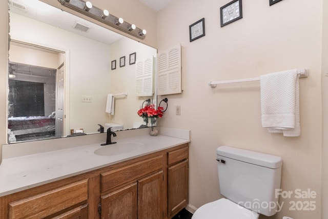 8175 Cedar Glen Dr, Charlotte, NC 28212 - bathroom featuring visible vents, toilet, and vanity