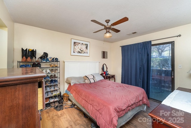 8175 Cedar Glen Dr, Charlotte, NC 28212 - bedroom with access to outside, wood finished floors, visible vents, and a textured ceiling