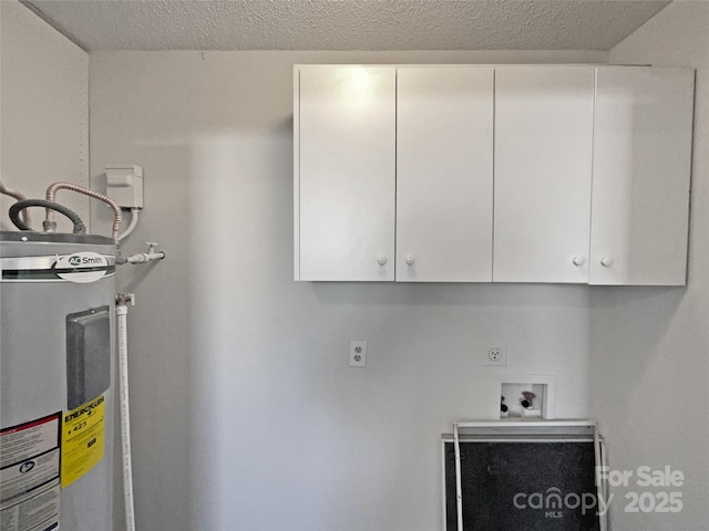 laundry room with water heater, hookup for a washing machine, cabinet space, hookup for an electric dryer, and a textured ceiling