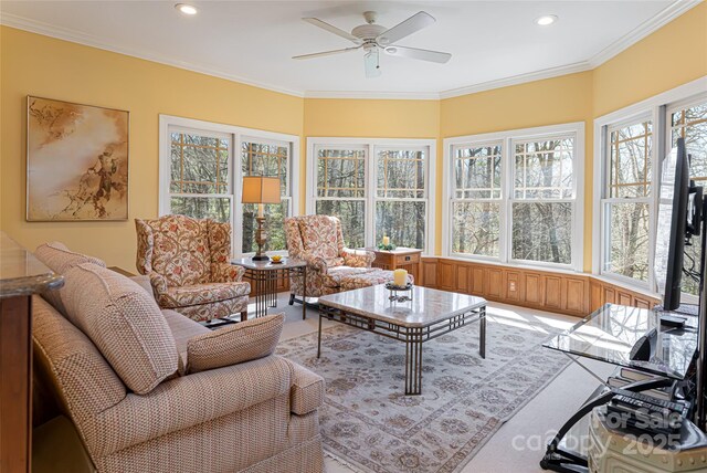 sunroom / solarium with ornamental molding, a healthy amount of sunlight, and recessed lighting