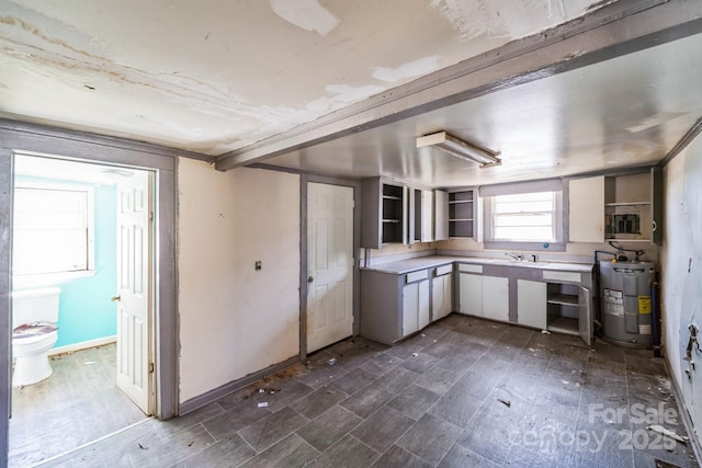 208 Columbia Ave, Rock Hill, SC 29730 - kitchen featuring electric water heater, light countertops, baseboards, and open shelves