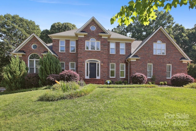 8011 Greencastle Dr, Charlotte, NC 28210 - georgian-style home featuring brick siding and a front yard
