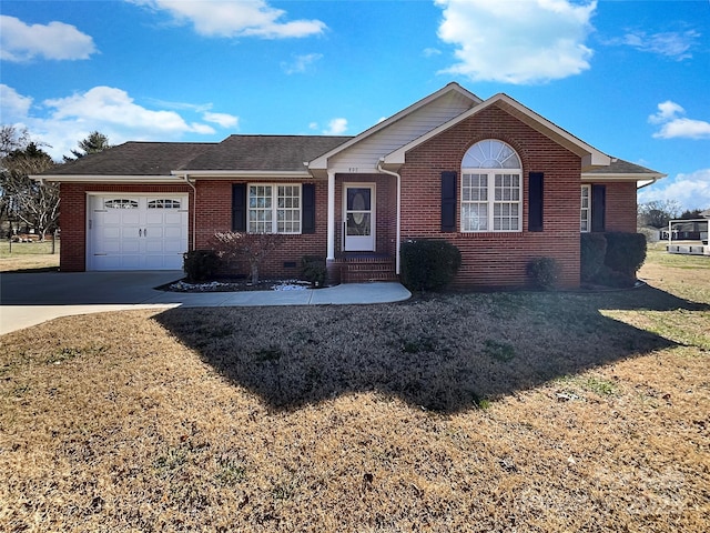 ranch-style house featuring a front lawn, brick siding, concrete driveway, and an attached garage