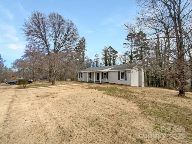 510 Newport Dr, Salisbury, NC 28144 - view of front facade with a front yard, a porch, and stucco siding