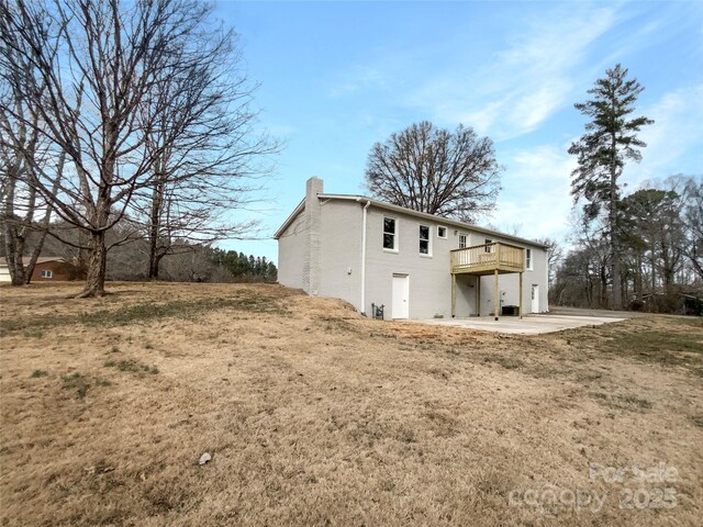 510 Newport Dr, Salisbury, NC 28144 - back of house featuring a patio, a deck, and a chimney