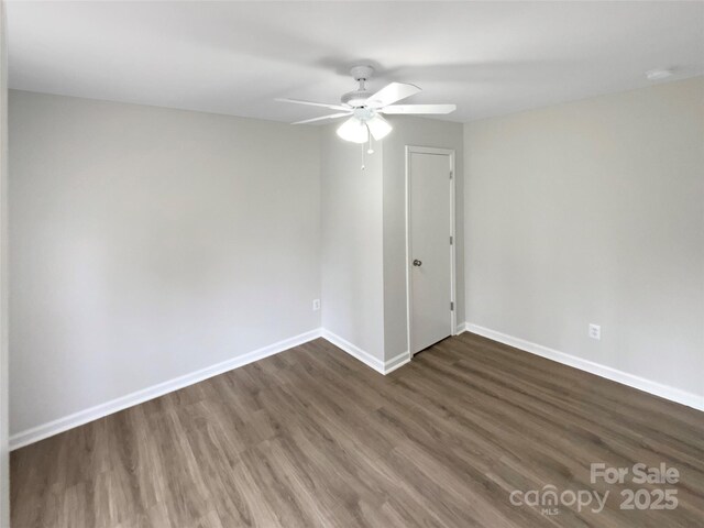 510 Newport Dr, Salisbury, NC 28144 - spare room featuring dark wood-style floors, a ceiling fan, and baseboards
