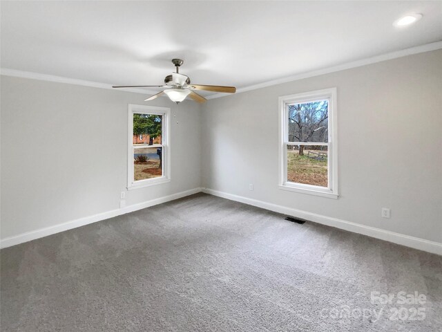 510 Newport Dr, Salisbury, NC 28144 - carpeted spare room featuring visible vents, a ceiling fan, crown molding, and baseboards