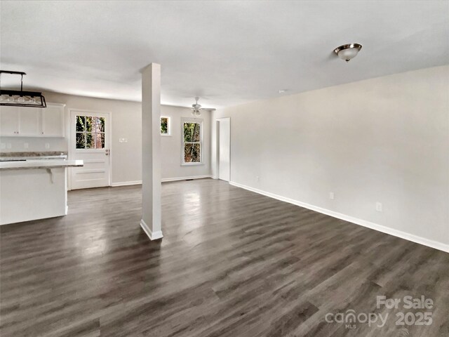 510 Newport Dr, Salisbury, NC 28144 - unfurnished living room with dark wood-style floors and baseboards