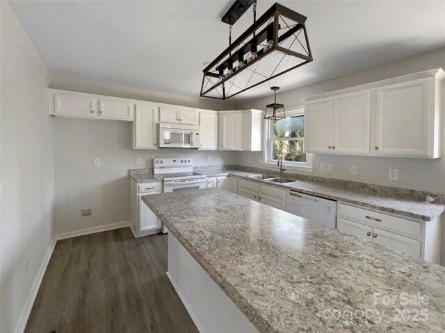 510 Newport Dr, Salisbury, NC 28144 - kitchen featuring a sink, baseboards, white appliances, and white cabinets